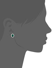 Load image into Gallery viewer, Amazon Collection Rhodium Plated Sterling Silver Created Emerald 8x6mm and Created White Sapphire Oval Halo Earrings