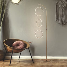 Load image into Gallery viewer, Brightech Nova Modern Floor Lamp - Contemporary Arc Tall Lamp with 3-Circle Ring-Style Pendant - Over The Couch Standing Lamp on Arching Pole - Eclectic Tall Lamp Matches Living Room Décor - Gold