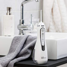 Load image into Gallery viewer, Waterpik Cordless Advanced Water Flosser For Teeth, Gums, Braces, Dental Care With Travel Bag and 4 Tips, ADA Accepted, Rechargeable, Portable, and Waterproof, White WP-560