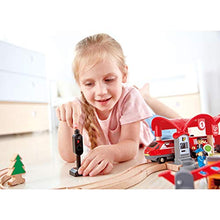 Load image into Gallery viewer, Hape Busy City Train Rail Set | Complete City Themed Wooden Rail Toy Set for Toddlers with Passenger Train, Freight Train, Station, Play Figurines, and More, Multicolor, Model:E3730