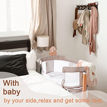Load image into Gallery viewer, Baby Bassinet Bedside Sleeper with Wheels Storage Basket Canopy 3 Hanging Toys Newborn Cosleeping Cribs for Infant Wooden Crib Adjustable Boy Girl Multi-Functional Bedside Sleeper Toffee