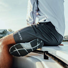 Load image into Gallery viewer, Huk Men's Next Level 7" Short | Quick-Drying Performance Fishing Shorts with UPF 30+ Sun Protection , Charcoal, Medium