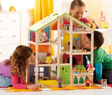 Load image into Gallery viewer, All Seasons Kids Wooden Dollhouse by Hape | Award Winning 3 Story Dolls House Toy with Furniture, Accessories, Movable Stairs and Reversible Season Theme L: 23.6, W: 11.8, H: 28.9 inch