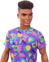 Load image into Gallery viewer, Barbie Ken Fashionistas Doll #162 with Rooted Brunette Hair Wearing Graphic Purple Top, Shorts & Yellow Shoes, Toy for Kids 3 to 8 Years Old