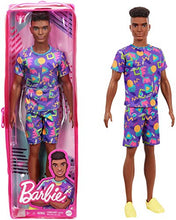 Load image into Gallery viewer, Barbie Ken Fashionistas Doll #162 with Rooted Brunette Hair Wearing Graphic Purple Top, Shorts & Yellow Shoes, Toy for Kids 3 to 8 Years Old