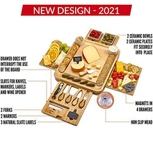 Load image into Gallery viewer, Cheese Board 2 Ceramic Bowls 2 Serving Plates. Magnetic 4 Drawers Bamboo Charcuterie Cutlery Knife Set, 2 Server Forks, Wine Opener, Labels, Markers, Gift for Birthdays, Wedding Registry,Housewarming