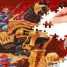 Load image into Gallery viewer, Masters of The Universe Mattel Jigsaw Puzzle with 500 Interlocking Pieces & Mini-Poster Featuring He-Man & Skeletor, Gift for Collectors & Kids Ages 8 Years Old & Up