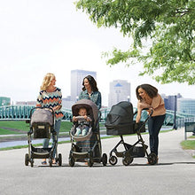 Load image into Gallery viewer, Evenflo Pivot Modular Travel System, Lightweight Baby Stroller, Sleek & Versatile, Easy Infant Car Seat Transfer, Oversized Storage Basket, Blanket Boot, Travel Stroller, 3-Panel Canopy, Sandstone Tan