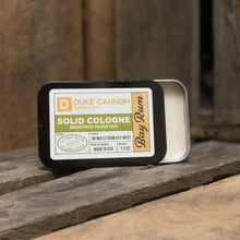 Load image into Gallery viewer, Duke Cannon Supply Co. Solid Cologne for Men Bay Rum (Citrus Musk, Cedarwood, Island Spice) - Concentrated Balm, Travel-Friendly Convenient Tin, Made with Natural &amp; Organic Ingredients 1.5 oz (1 unit)
