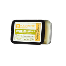 Load image into Gallery viewer, Duke Cannon Supply Co. Solid Cologne for Men Bay Rum (Citrus Musk, Cedarwood, Island Spice) - Concentrated Balm, Travel-Friendly Convenient Tin, Made with Natural &amp; Organic Ingredients 1.5 oz (1 unit)
