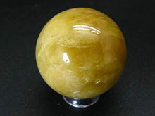 Load image into Gallery viewer, Large Agni Golden Yellow Cats Eye Danburite Sphere Ball from Tanzania - 1.4&quot; - 63.5 Grams
