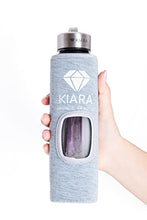 Load image into Gallery viewer, Kiara Crystal Elixir Bottle | 16oz Natural Gemstone Water Bottle for Making Crystal Infused Gemwater | Includes Premium Healing Crystal, Free E-Book and Neoprene Sleeve (Super Sleeve - Amethyst)
