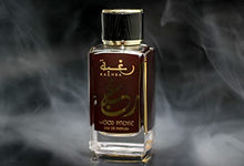 Load image into Gallery viewer, Raghba for Women EDP (Eau De Parfum) I middle eastern baked sweets in a spice market scent I Warm, cozy, and smoky Vanilla add a sweet, elegance I Long - lasting and Great Silliage I by Lattafa Perfumes (Raghba Woody Intense - 100 ML)
