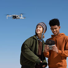 Load image into Gallery viewer, DJI Mini 2 Fly More Combo – Ultralight Foldable Drone, 3-Axis Gimbal with 4K Camera, 12MP Photos, 31 Mins Flight Time, OcuSync 2.0 10km HD Video Transmission, QuickShots, Gray
