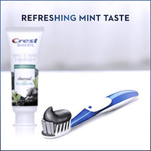 Load image into Gallery viewer, Crest Charcoal 3D White Toothpaste, Whitening Therapy, with Tea Tree Oil, Refreshing Mint flavor, 4.1 oz, Pack of 3

