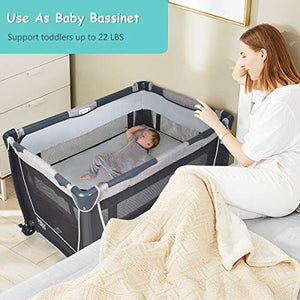 BABY JOY 4 in 1 Portable Baby Playard with Bassinet, Changing Table, Foldable Bassinet Bed & Activity Center, Newborn Napper with Toys & Music, Large Capacity Storage Shelf, Oxford Carry Bag (Grey)