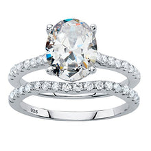 Load image into Gallery viewer, Platinum over Sterling Silver Oval Cut and Round Cubic Zirconia 2 Pair Bridal Ring Set Size 9
