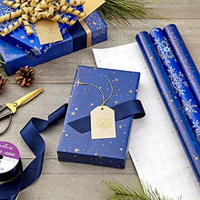 Load image into Gallery viewer, Hallmark Holiday Wrapping Paper with Cut Lines on Reverse (3 Rolls: 120 sq. ft. ttl) Starry Snowflakes, Winter Galaxy, Navy Blue, Gold for Christmas, Hanukkah, Birthdays, Graduations, Weddings
